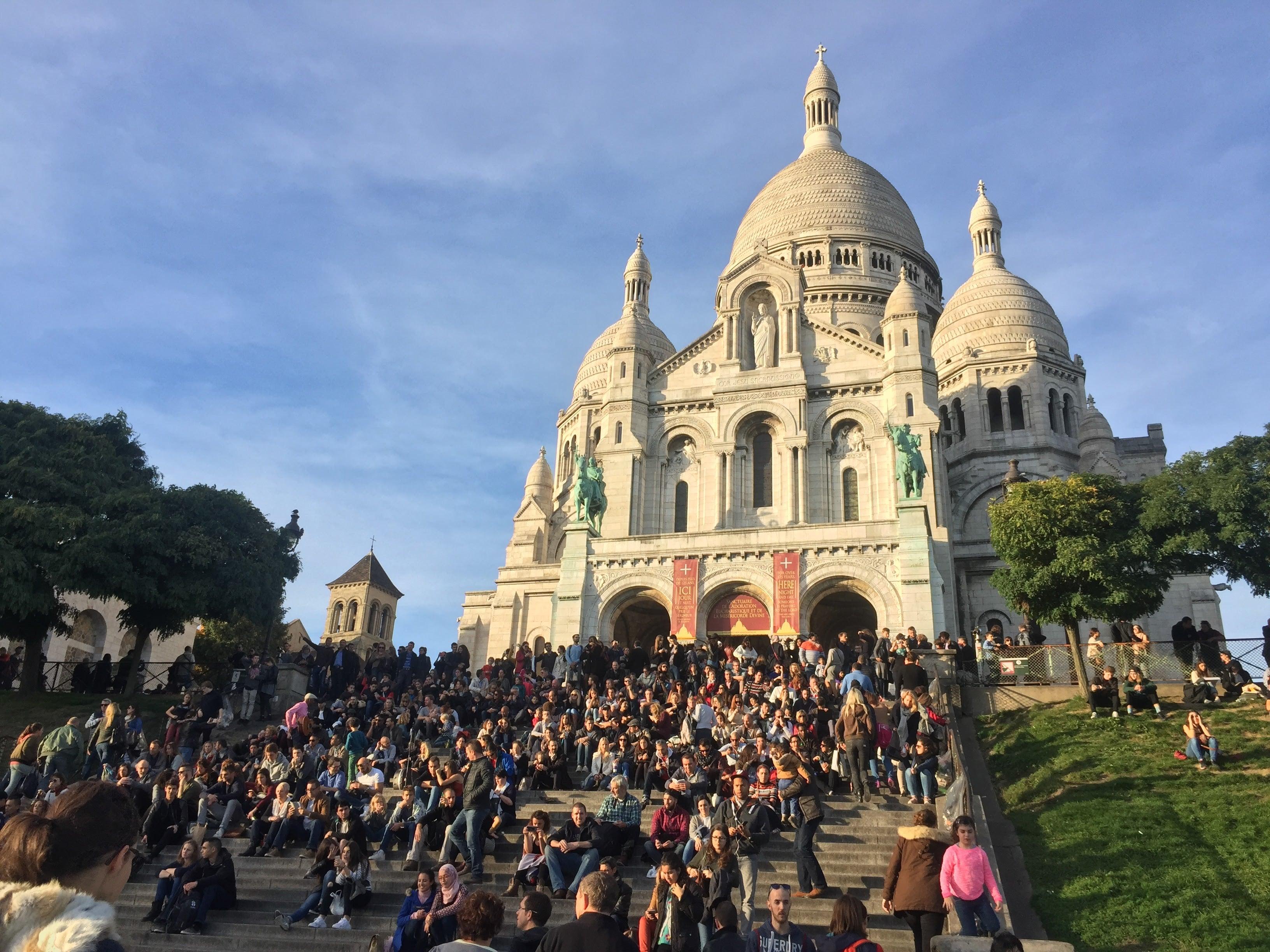 Crowds gathered on the steps of Sacre-Coeur basilica in Paris