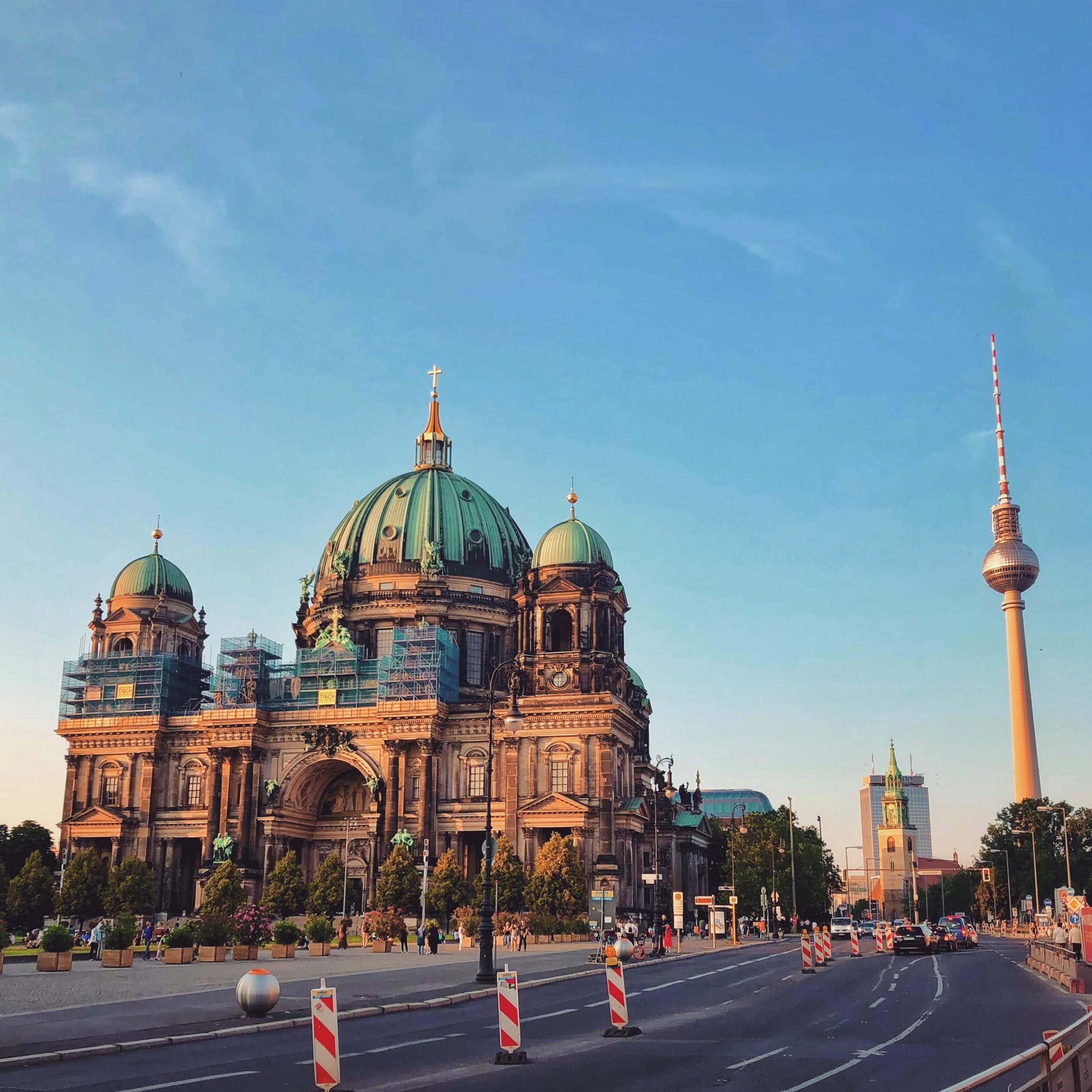 Berlin Cathedral and TV Tower under a clear evening sky