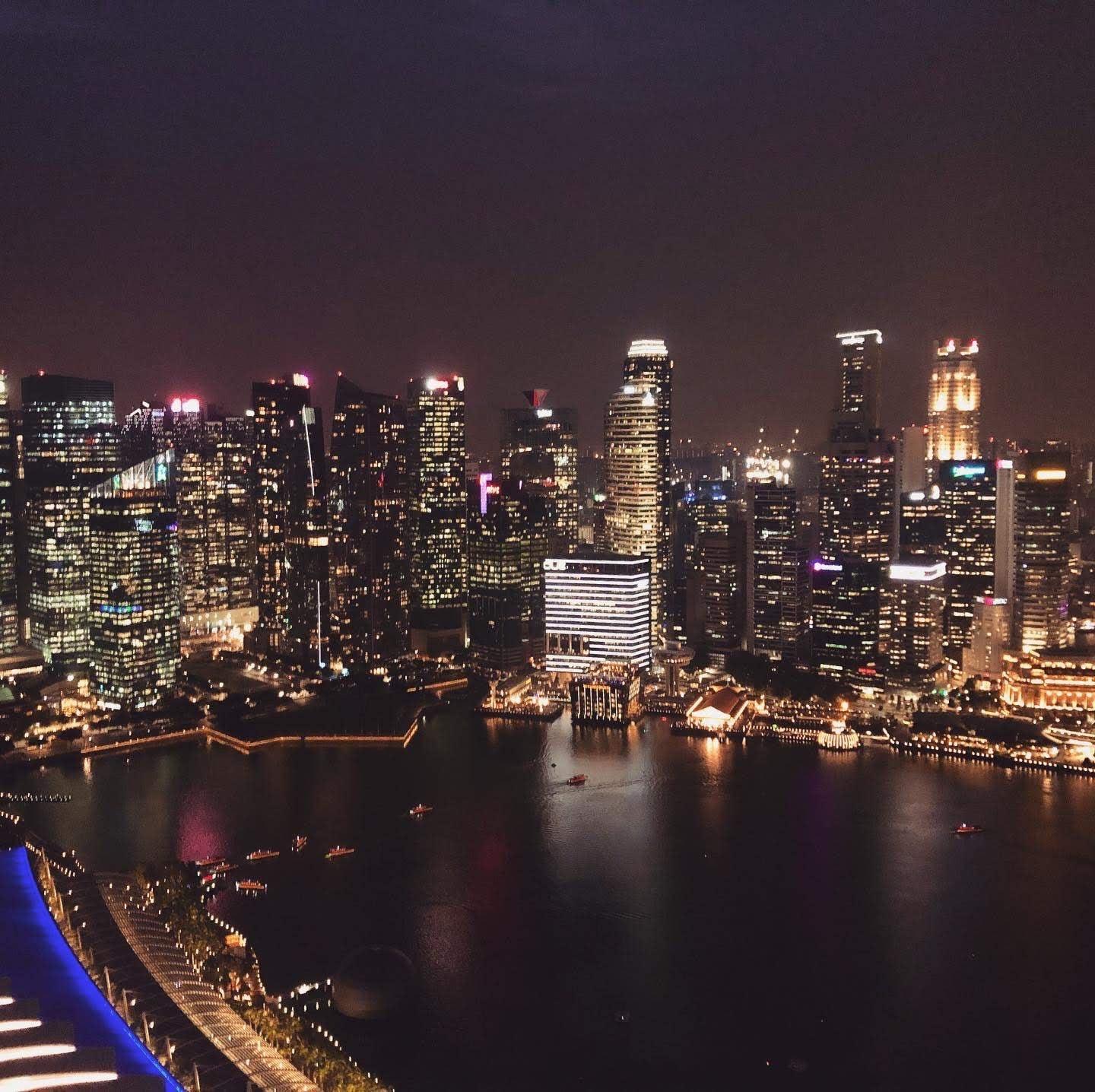 Singapore Marina Bay skyline illuminated at night from above