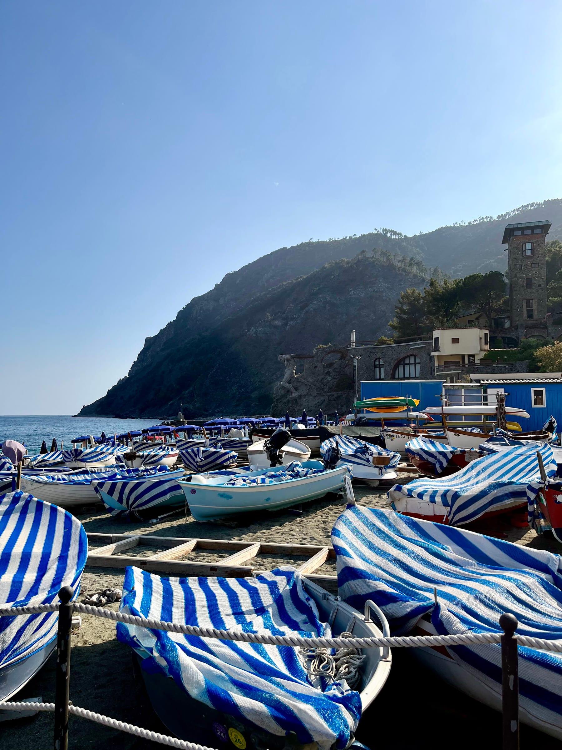 Striped boat covers on beach