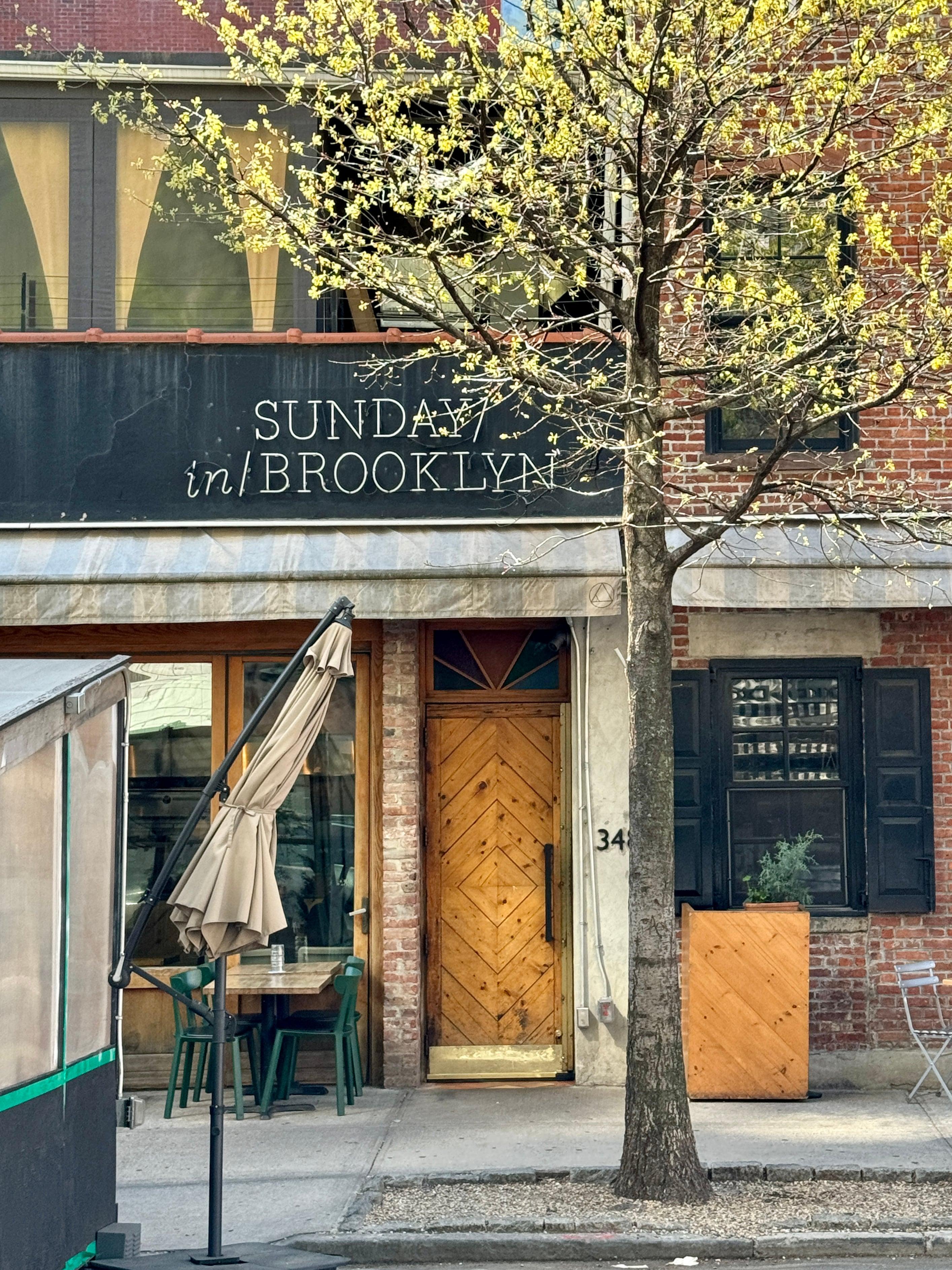 Brooklyn restaurant brick facade with spring tree