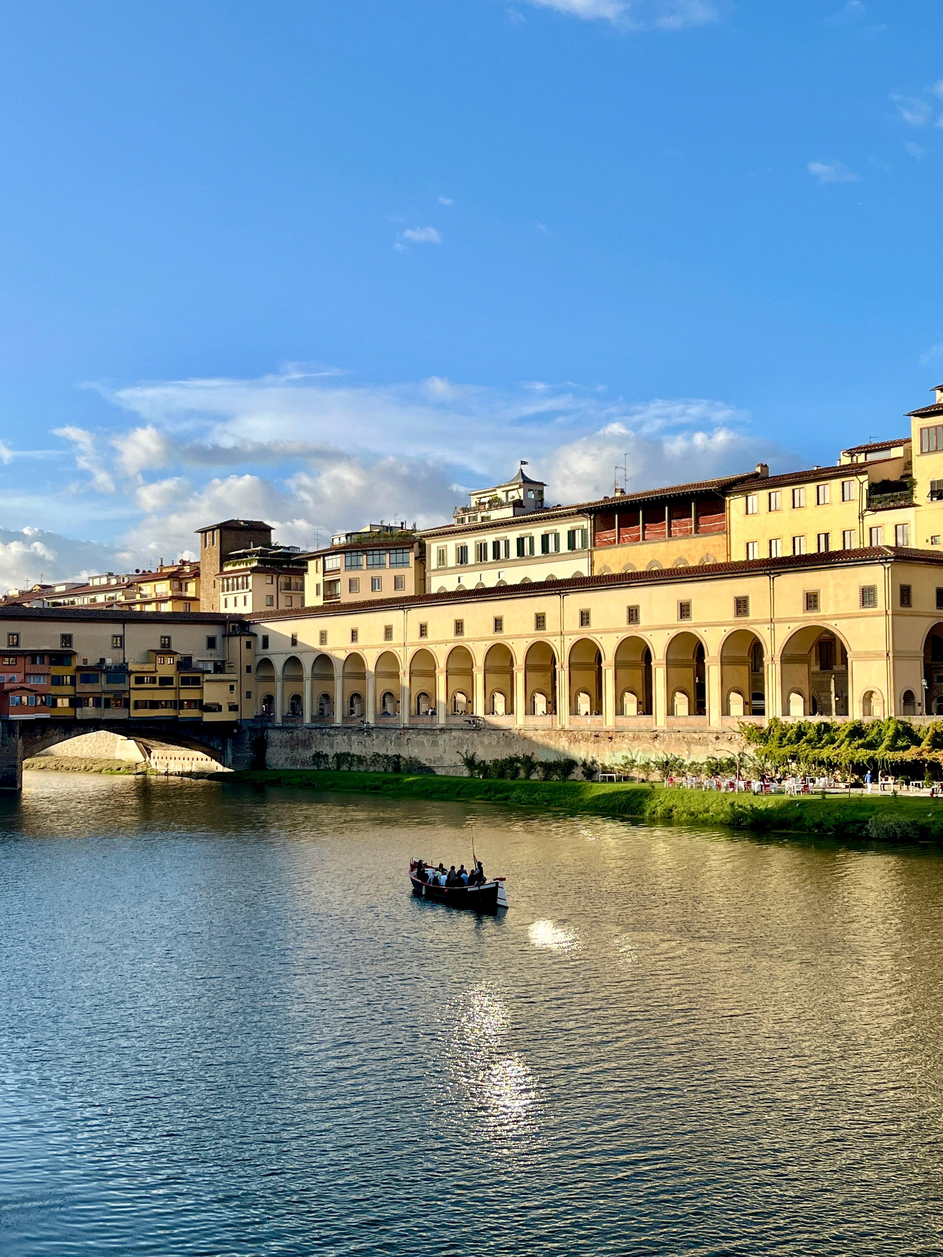 Boat on the River Arno near Ponte Vecchio in Florence