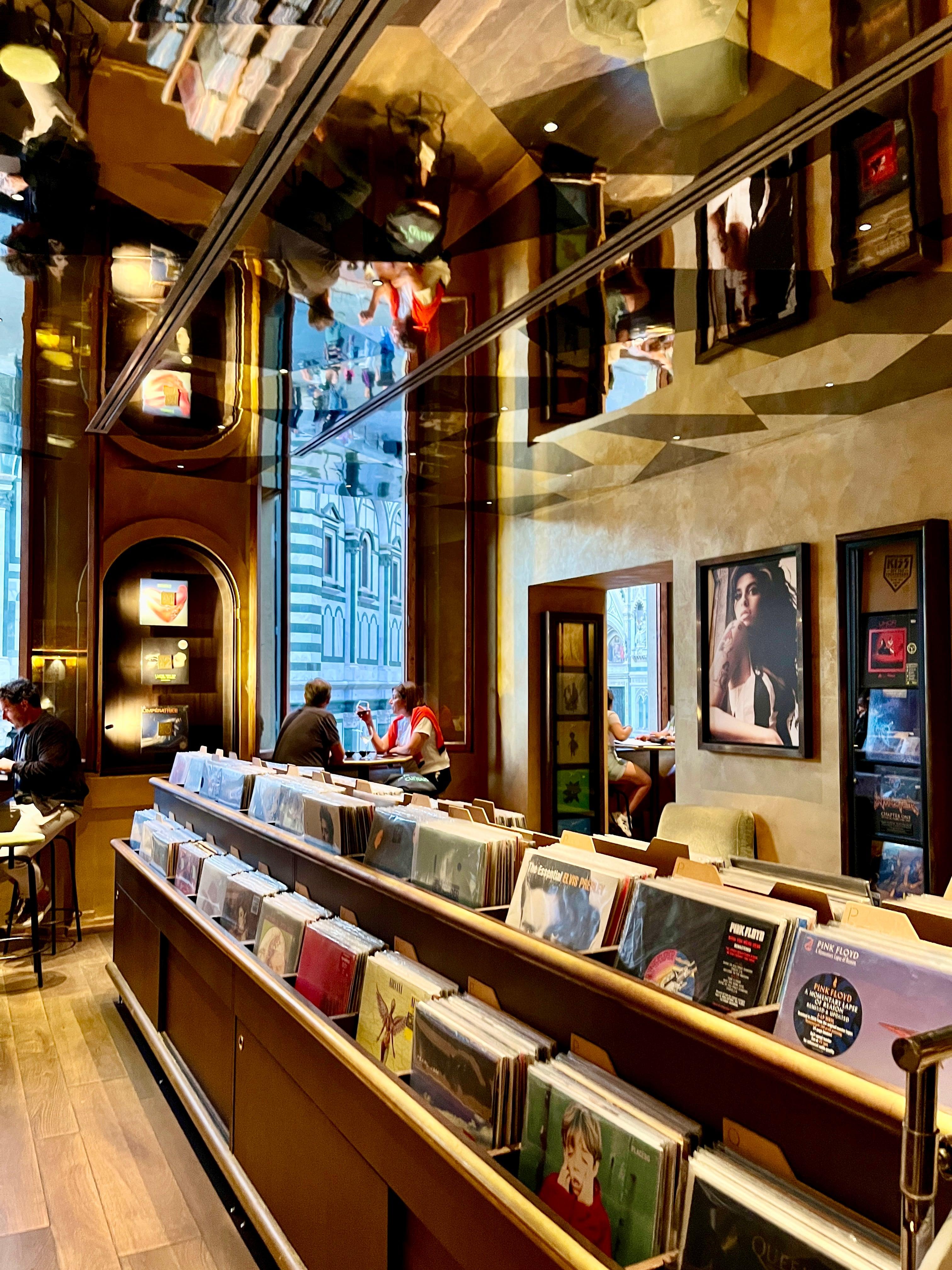 Vinyl record shop interior with mirrored ceiling in Florence