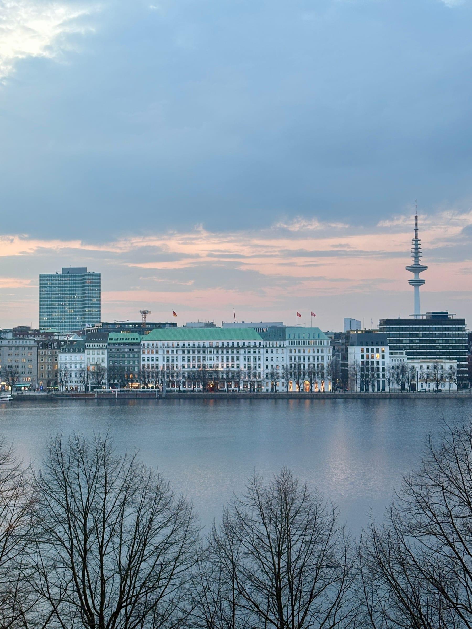 Dusk skyline across the Alster lake in Hamburg with TV tower